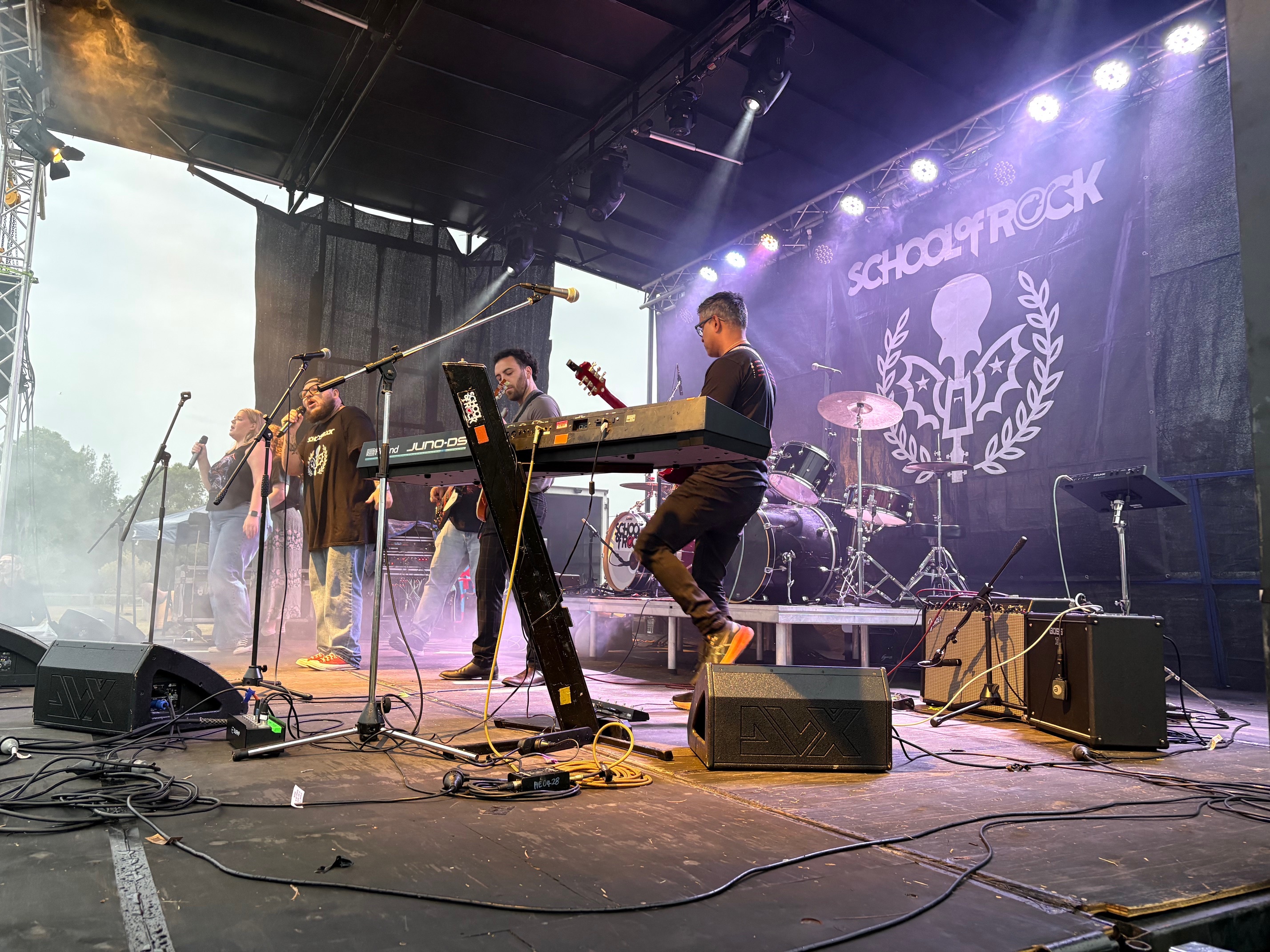 lead singer of the band singing into the microphone